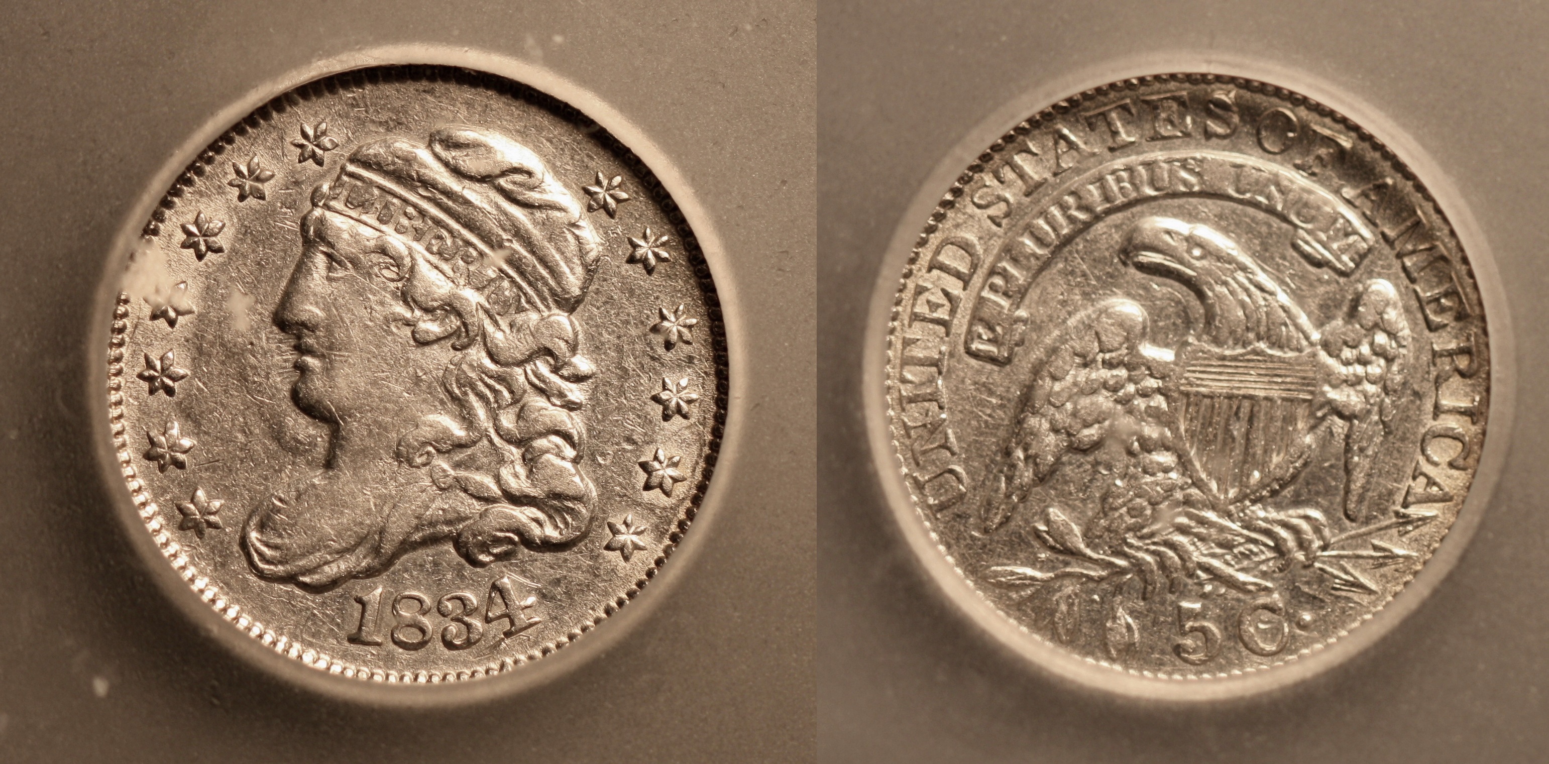 1834 Capped Bust Half Dime ICG AU-50 camera