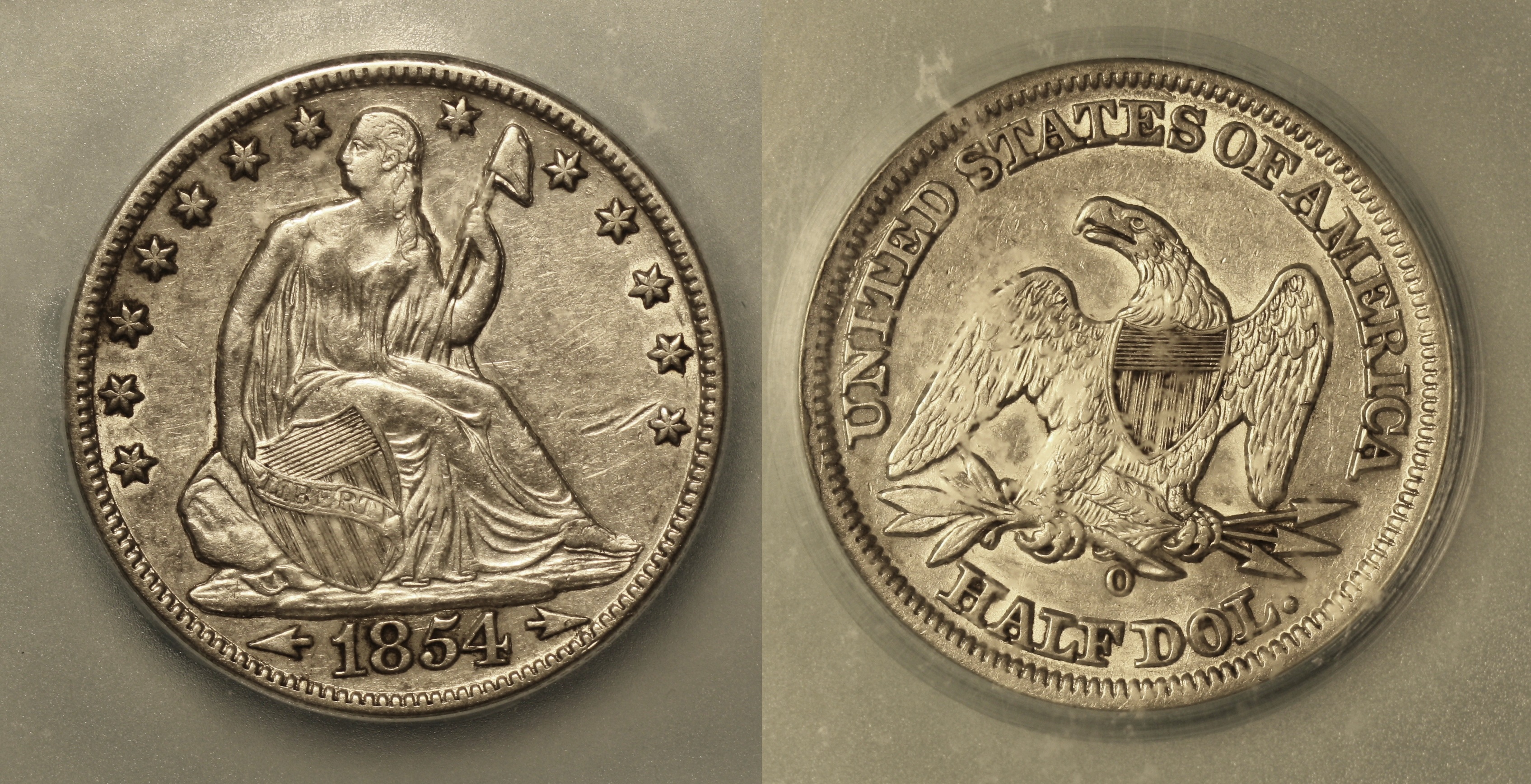 1854-O Seated Liberty Half Dollar ICG AU-50 camera