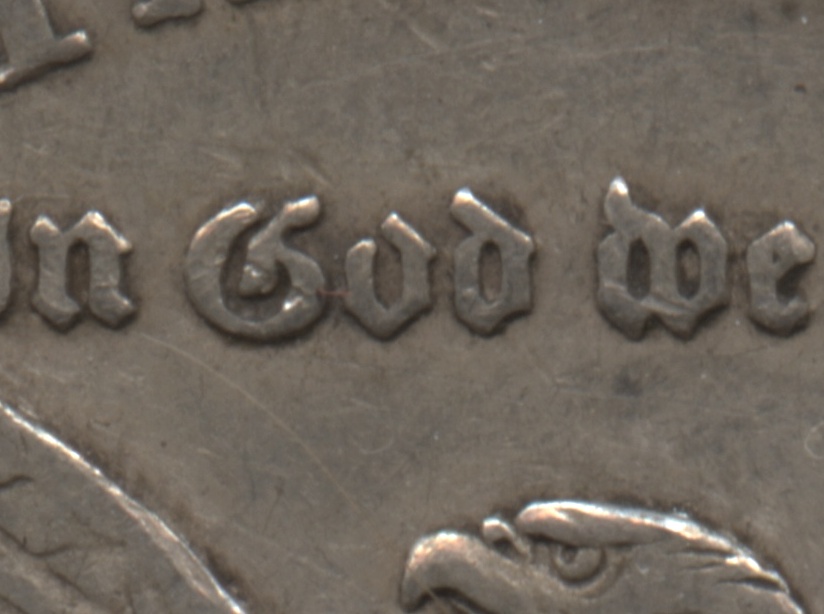 Showing the open O in God on the reverse
