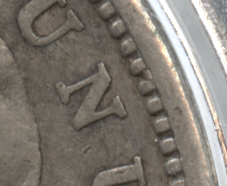 Note the die gouge in the denticles above the N in Unum